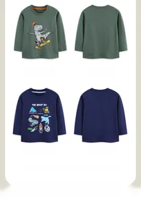Detail view of long-sleeved kids' dinosaur and star-themed t-shirts in green and navy