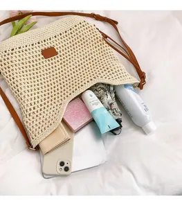 Detail showing high-capacity woven tote bag filled with daily essentials for beach vacation