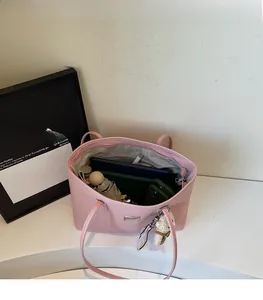 Interior view of large pink tote bag showing spacious storage for daily essentials