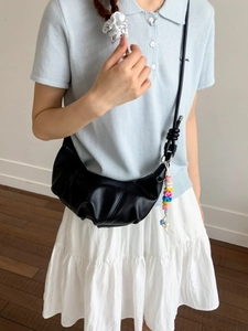 Minimalist black pleated crescent shoulder bag with colorful beaded letter charms