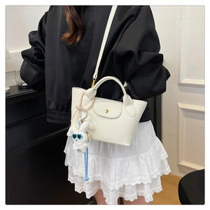 Mini white tote bag in lychee pattern leather with a cute white rabbit pendant detail