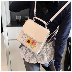 Detail of cream white backpack with sunflower PVC window and adjustable straps
