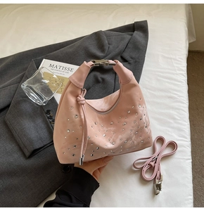 Pink pleated handbag with silver rhinestones, including a matching thin shoulder strap