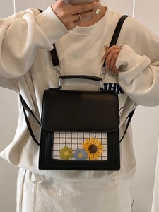 Fashionable black faux leather backpack with transparent flower window and top handle