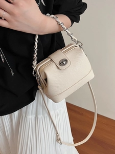 Chic beige lychee leather crossbody bag with chain strap and silver twist lock closure