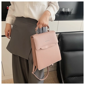 Detail showing high-quality pink faux leather texture and metallic Fashion lettering on bag