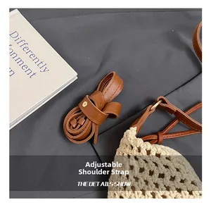 Close-up of adjustable brown leather shoulder strap with woven cotton details