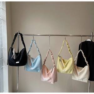 Detailed display of tote bags in five colors with stylish ruched cloud shoulder straps