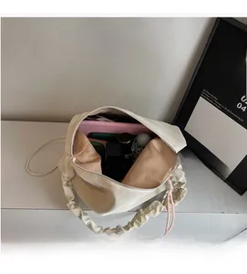 Interior view showing large capacity for tablet and umbrella in beige tote bag