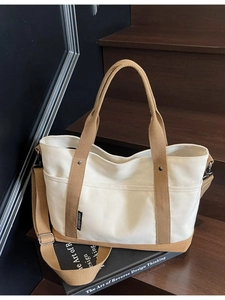 Large minimalist canvas tote bag in beige and khaki with adjustable shoulder strap