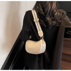 Chic beige lychee leather pillow bag with stylish wide patterned shoulder strap