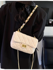 Chic beige quilted crossbody bag with gold chain strap and elegant metallic turn-lock