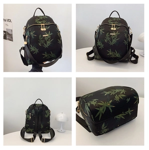 Detailed four-angle views of a black backpack featuring green bamboo leaf patterns and gold zippers
