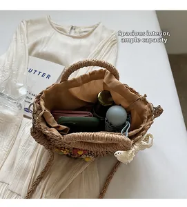 Interior view of straw bag showing large capacity for phone wallet and essentials