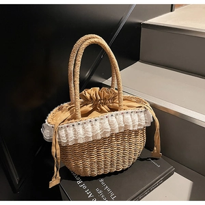 Detailed macro view of woven straw handbag with white lace trim and drawstring closure