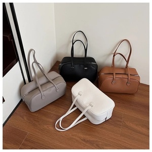Detail showing high-quality lychee texture leather bags in black, grey, white and tan