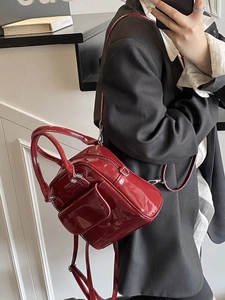 Glossy deep red patent leather mini backpack and handbag with stylish silver hardware