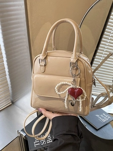 Chic beige patent leather backpack with pearl chain and heart charm for women