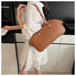Brown lychee-textured leather Boston bag with dual straps and silver hardware detail
