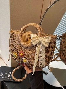 Semicircle straw bag with lace bow and crochet flowers for summer beach vacations