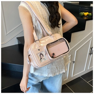 Detailed close-up of a pink high-glossita bag with transparent dual display windows
