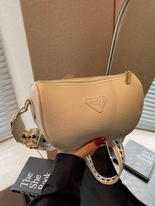 Fashionable beige cylinder pillow bag with wide geometric strap for women's daily commute