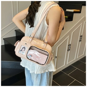 Detailed view of pink shiny faux leather tote bag with transparent display window