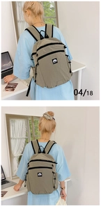 Detailed back view of khaki nylon functional backpack with drawstring side pocket design
