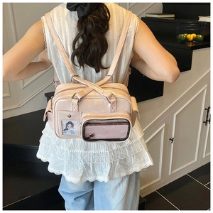 Detail of pink faux leather multifunctional backpack with transparent pockets and straps