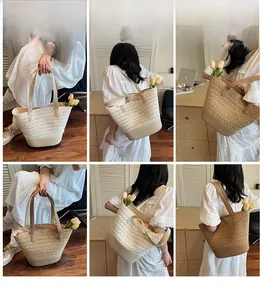 Dettagli della borsa tote grande in paglia intrecciata in crema e marrone da spiaggia