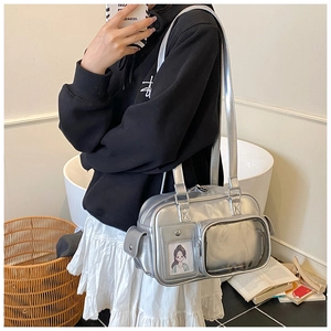 Close-up of a silver metallic Y2K shoulder bag featuring a clear window and sleek PU finish