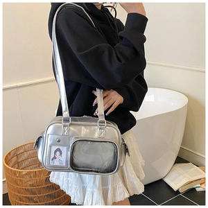 Detail view of silver metallic commuter bag with clear display window and card slot