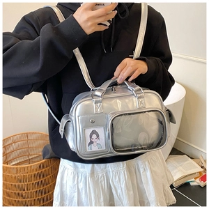 Silver metallic backpack featuring a clear PVC window for pins and adjustable straps