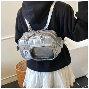 Close-up of a silver ita bag featuring a transparent window for decorative pins and cards