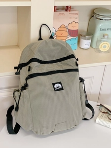 Light green casual backpack with durable plaid texture and square logo for daily travel