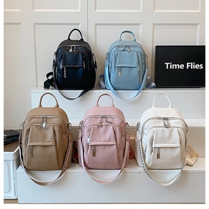Collection of premium faux leather backpacks in five pastel colors with metal zippers