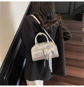 Silver Boston bag featuring metallic leather finish and pearl lace bow charm