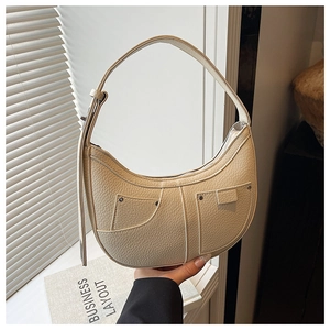 Detail of off-white lychee pattern leather shoulder bag with pocket stitching design