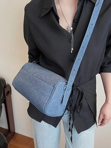 Fashionable blue denim cylinder shoulder bag with adjustable strap for women in summer