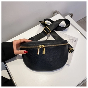 Detail of black lychee texture leather chest bag with premium gold zipper and nylon strap