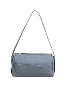 Minimalist light blue denim cylinder shoulder bag with silver zipper and sleek strap