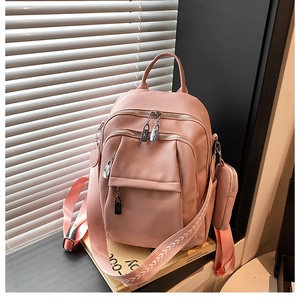 Pink PU leather backpack featuring lychee texture, multi-zipper pockets, and woven strap