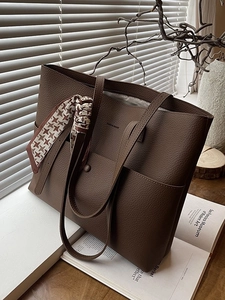 Classic dark brown tote bag in textured leather with a stylish houndstooth silk scarf detail