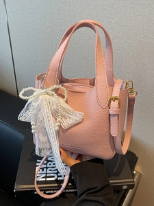 Pink lychee grain leather bucket bag with pearl bow and lace charm for women