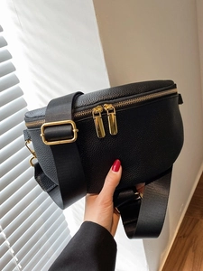 Fashionable black pebbled leather crossbody waist bag with gold zipper and wide strap