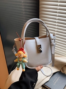 Lavender faux leather bucket bag with silver clasp and cute pearl doll pendant