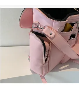 Detail showing side zipper pocket and large capacity of pink motorcycle style backpack