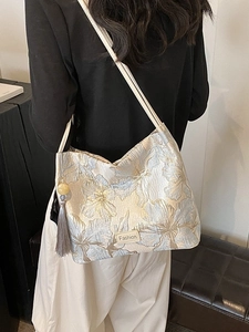 Vintage style floral jacquard tote bag with blue gold embroidery and grey tassel detail