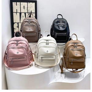 Detail view of large capacity backpacks with multi-zipper layers and woven straps