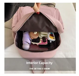 Pink faux leather backpack interior showing spacious main compartment for daily items